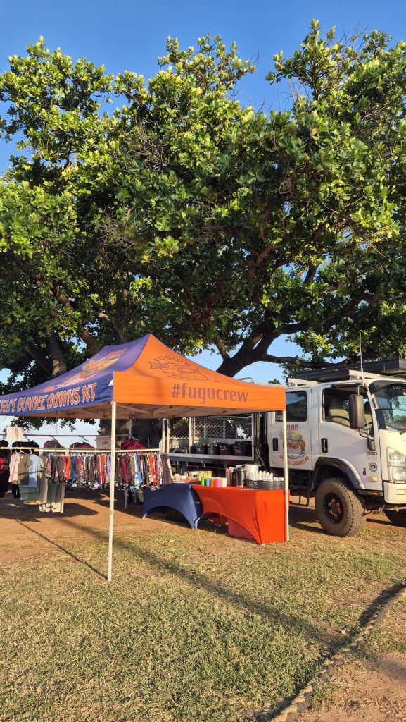 Fugu's Dundee Downs NT market stall with the #fugucrew marquee and flag at the Dundee Beach Markets