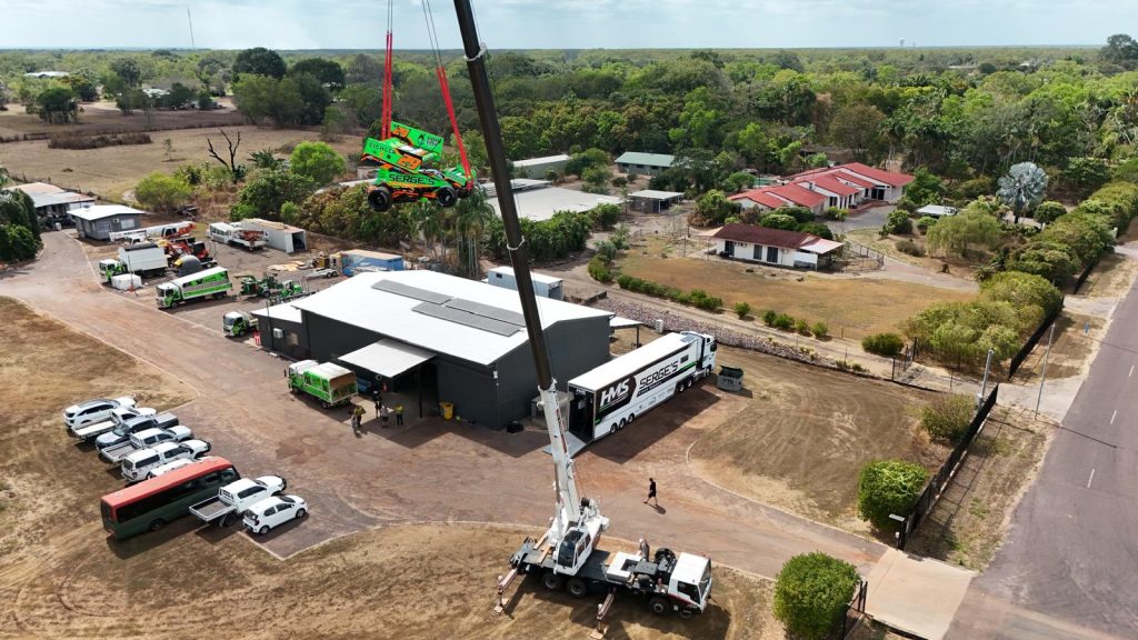 Xtreme Crane Hire mobile crane lifting at a commercial yard in the NT
